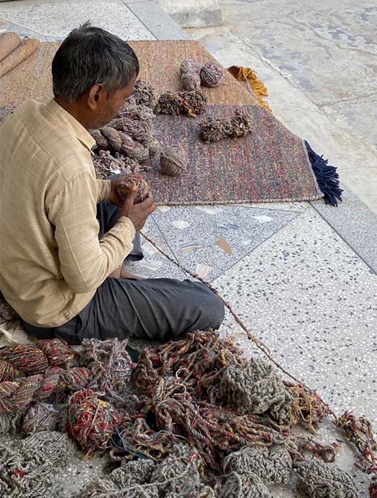 Indian artisan working on the Re-Rug Collection.
