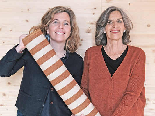 Maria Piera Marquina and Nani Marquina holding a Ceras rug